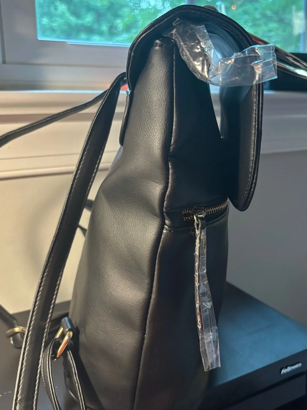 bebe Black Faux Leather Backpack with Gold Handle & Plaque